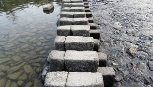 stone steps across the water in seattle are an example of mindfulness tools to help you better navigate the stress of life challenges